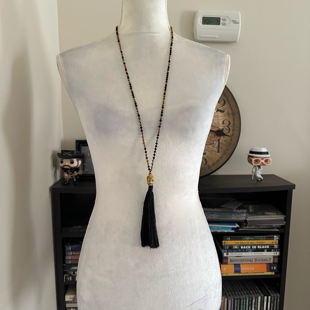 Buddha head tassel pendant necklace.